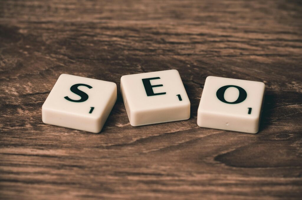 pexels-photo-270637-270637 Scrabble tiles spelling 'SEO' on a wooden surface. Ideal for digital marketing themes.